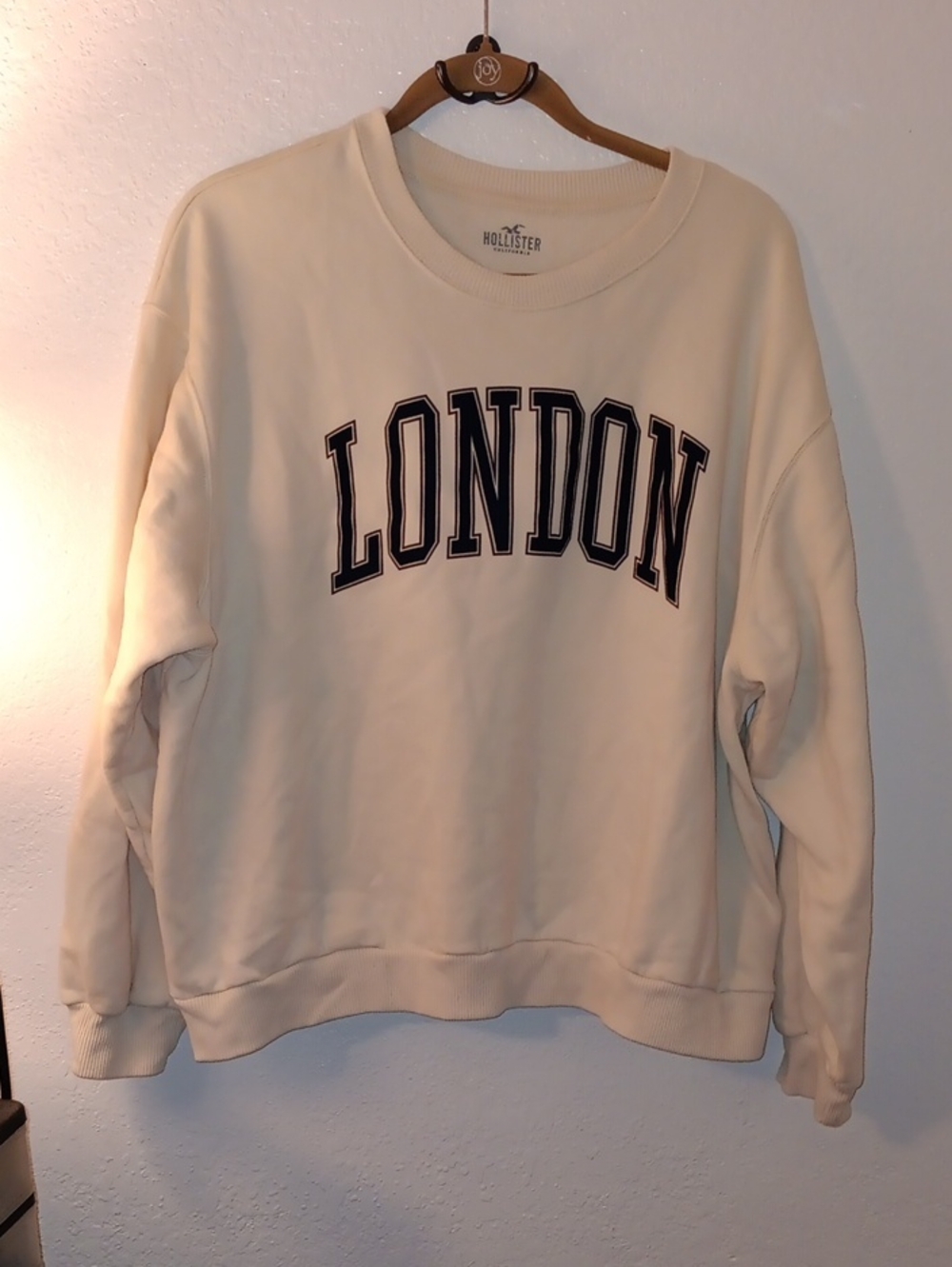 Hollister Cream Crewneck Sweatshirt with Navy 'LONDON' Appliqué